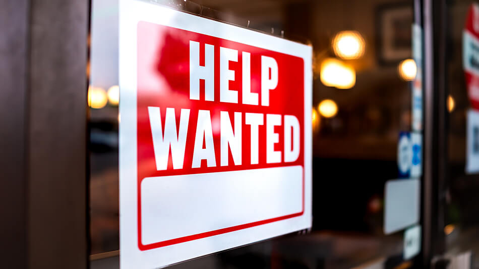Help wanted sign in store window