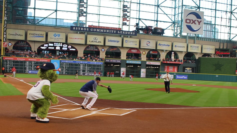 Stacy Kymes throwing the first pitch at an Astros game
