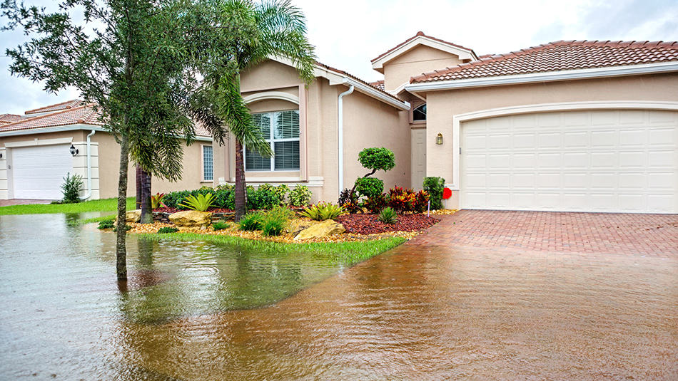 Water rising toward a home during a flood.