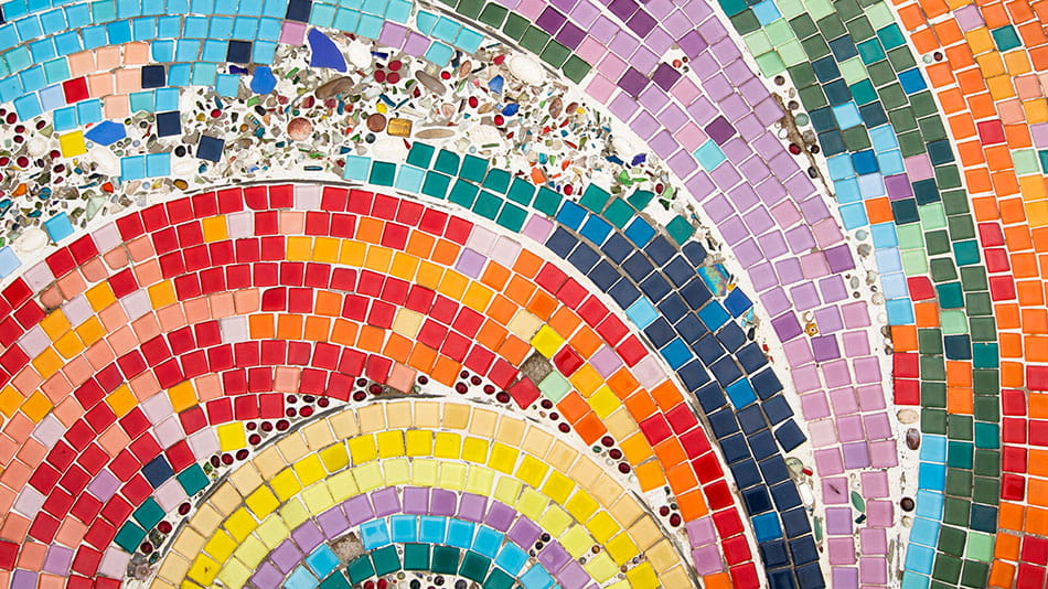 Rainbow mosiac made of tiles representing diversity, inclusion and community