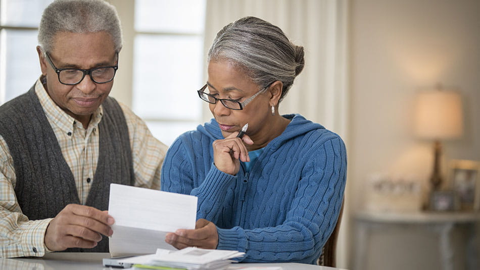 Couple discussing when to take social security