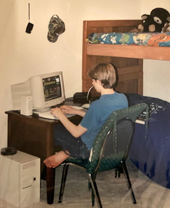 Photo of Kris Jackson working on old computer