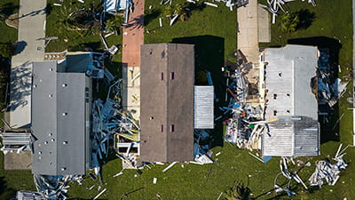 Aerial photo of homes damaged by storms
